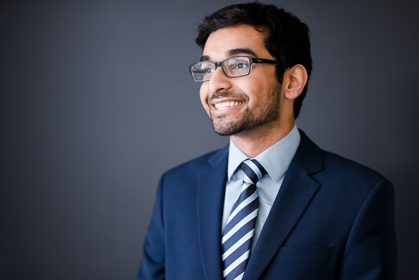Nabeen Ahmed headshot against a dark backdrop