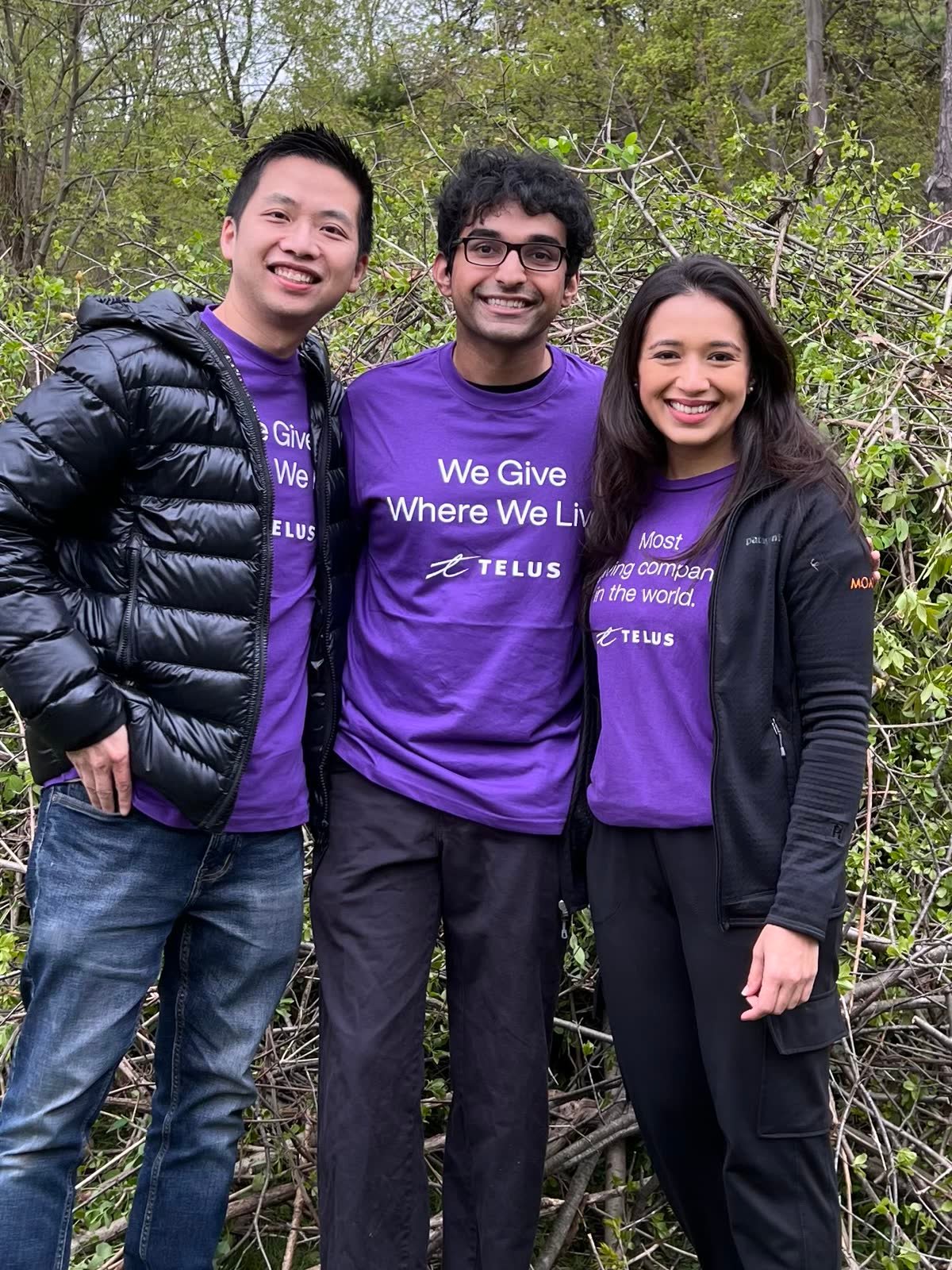 Nabeen with TELUS teammates in purple We Give Where We Live shirts